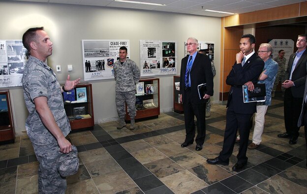 Col. Sean McElhaney Pahia, Air Reserve Personnel Center vice commander, greets and gives a mission brief to visitors during Mayor’s Day at Headquarters ARPC Oct. 8, 2015, on Buckley Air Force Base, Colo. The local mayors and visitors who attended the event included Mayor Steve Hogan, Mayor Cathy Noon, Mayor Herb Atchison, Mayor Phillip Cernanec, Mayor Clint Folsom, Mayor Heidi Williams, Mayor Joyce Thomas, Mayor Marjorie Sloan, Mr. Peter Kenney, Mr. Anthony Graves, Col. John Wagner, 460th Space Wing commander, Col. Scott Romberger, 460 SW vice commander, and Chief Master Sgt. Brian Kruzelnick, 460 SW command chief. (U.S. Air Force photo/Quinn Jacobson) 