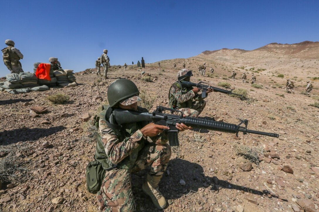 U.S. 5TH FLEET AREA OF OPERATIONS (Aug. 26, 2015) Jordanian Soldiers and U.S. Marines with India Company, Battalion Landing Team 3rd Battalion, 1st Marine Regiment, 15th Marine Expeditionary Unit, provide security during a bilateral training evolution. The 15th MEU is deployed throughout the U.S. 5th Fleet area of operations to maintain regional security. (U.S. Marine Corps photo by Sgt. Jamean Berry/Released)
