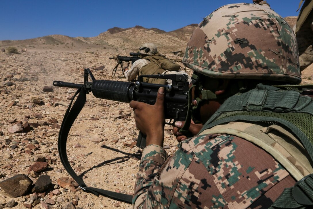U.S. 5TH FLEET AREA OF OPERATIONS (Aug. 26, 2015)  Jordanian Soldiers fire M4 carbines alongside U.S. Marines from India Company, Battalion Landing Team 3rd Battalion, 1st Marine Regiment, 15th Marine Expeditionary Unit during a bilateral training evolution. The 15th MEU is deployed throughout the U.S. 5th Fleet area of operations to maintain regional security. (U.S. Marine Corps photo by Sgt. Jamean Berry/Released)