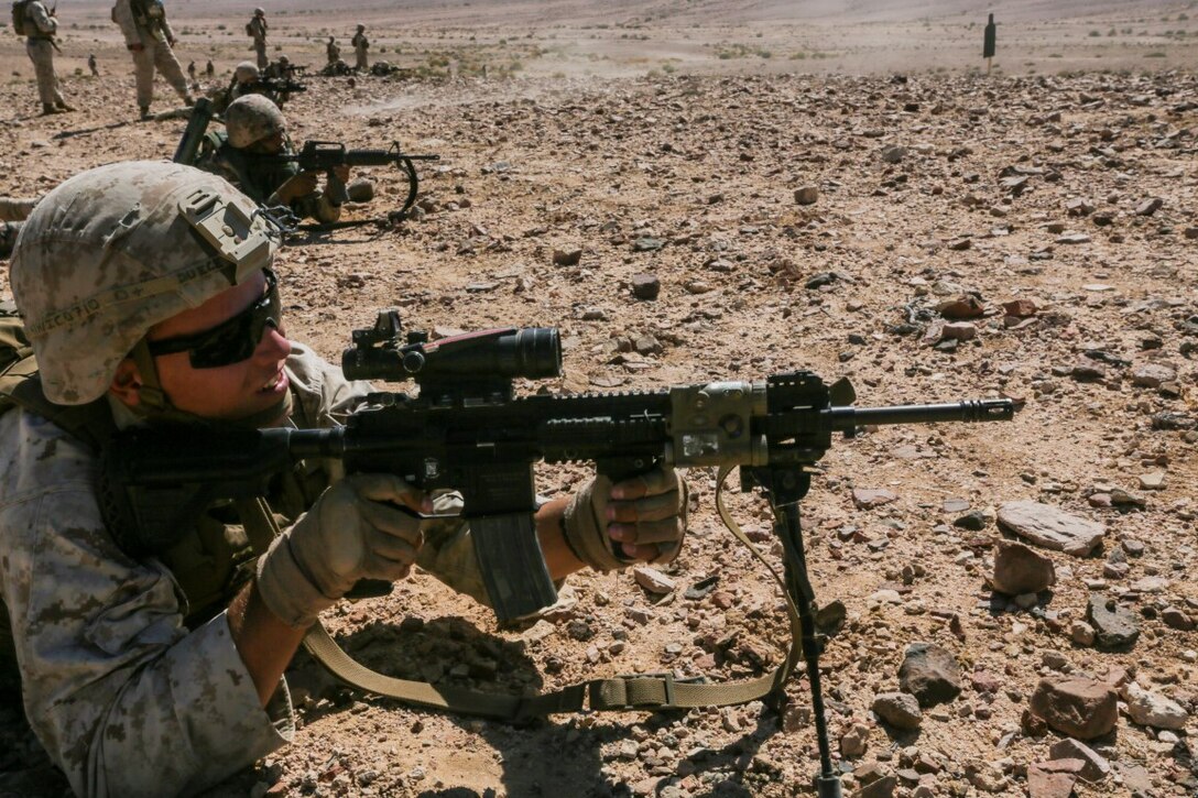 U.S. 5TH FLEET AREA OF OPERATIONS (Aug. 26, 2015)  U.S. Marine Cpl. Zackary Cox fires at targets alongside Jordanian Soldiers during a bilateral training evolution. Cox is an infantry automatic rifle gunner with India Company, Battalion Landing Team 3rd Battalion, 1st Marine Regiment, 15th Marine Expeditionary Unit. The 15th MEU is deployed throughout the U.S. 5th Fleet area of operations to maintain regional security. (U.S. Marine Corps photo by Sgt. Jamean Berry/Released)