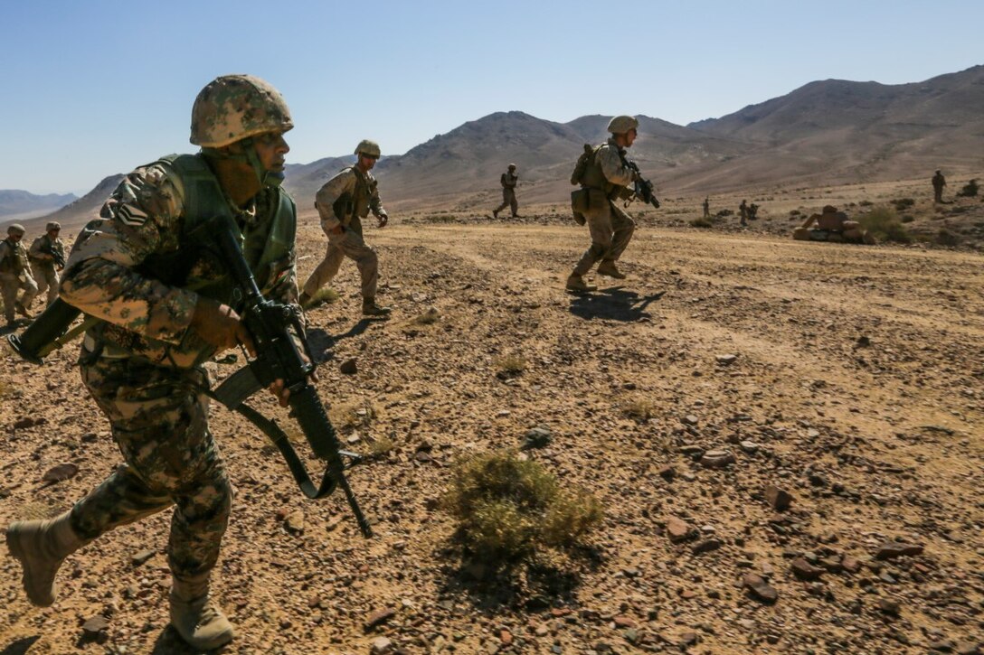U.S. 5TH FLEET AREA OF OPERATIONS (Aug. 26, 2015) U.S. Marines with India Company, Battalion Landing Team 3rd Battalion, 1st Marine Regiment, 15th Marine Expeditionary Unit, buddy-rush alongside Jordanian Soldiers during a bilateral training evolution. The 15th MEU is deployed throughout the U.S. 5th Fleet area of operations to maintain regional security. (U.S. Marine Corps photo by Sgt. Jamean Berry/Released)