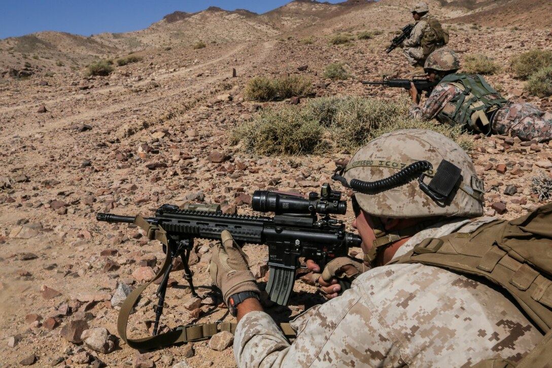 U.S. 5TH FLEET AREA OF OPERATIONS (Aug. 26, 2015) U.S. Marine Cpl. Zackary Cox fires at targets alongside Jordanian Soldiers during a bilateral training evolution. Cox is an infantry automatic rifle gunner with India Company, Battalion Landing Team 3rd Battalion, 1st Marine Regiment, 15th Marine Expeditionary Unit. The 15th MEU is deployed throughout the U.S. 5th Fleet area of operations to maintain regional security. (U.S. Marine Corps photo by Sgt. Jamean Berry/Released)