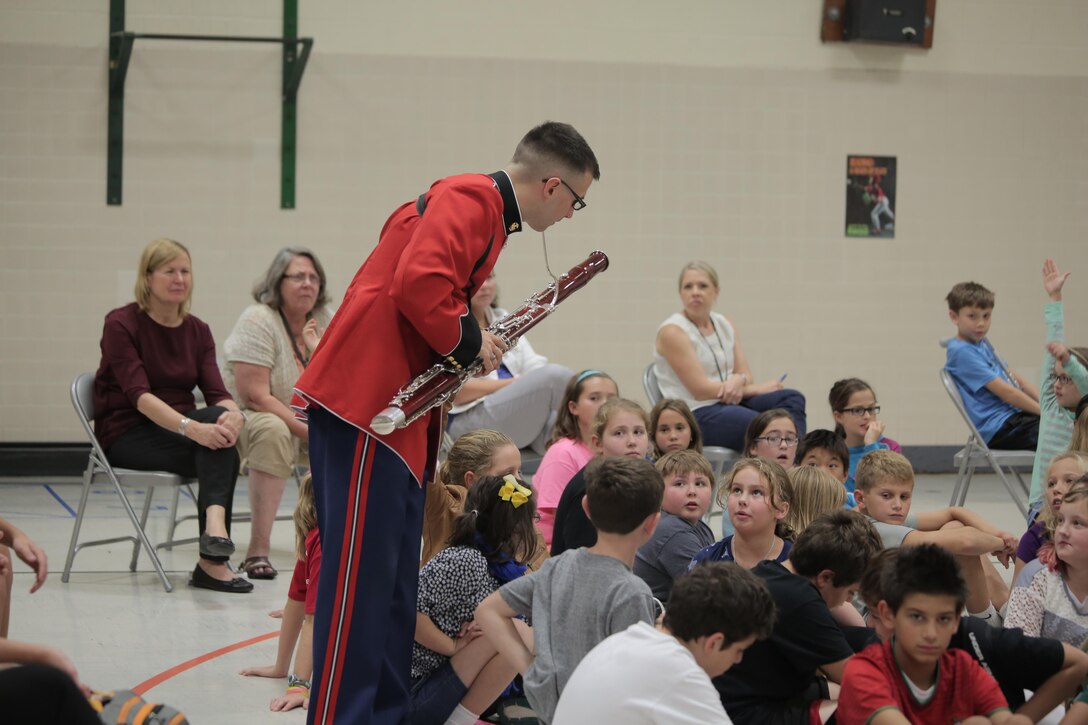 On Thursday, Oct. 8, a woodwind quintet from "The President's Own" U.S. Marine Band performed a Music in the Schools (MITS) program for fourth, fifth, and sixth graders at Waynewood Elementary School in Alexandria, Va. The band director, Jane Morgan, said at the conclusion of the presentation a sixth grader asked her if it was too late to sign up for band because he really liked what the quintet could do. A MITS success story! (U.S. Marine Corps photo by Master Sgt. Kristin duBois/released)