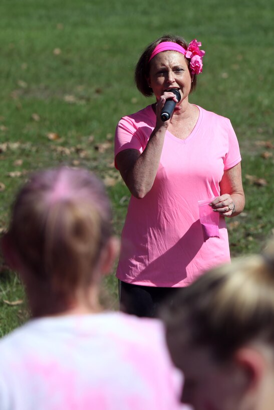 Capt. Angela S. Nimmo gives a speech during the 10th Annual Breast Cancer Awareness 5K Paint Run hosted by the Naval Health Clinic at Marine Corps Air Station Cherry Point, N.C., Oct. 9, 2015. The NHC hosted the 5K to promote awareness for breast cancer testing and early detection. According to the American Breast Cancer Society, one in eight women will develop invasive breast cancer over the course of her life time. More than two hundred participants showed up to the 5K to show their support for the cause. Nimmo is the commanding officer of the NHC. (U.S. Marine Corps photo by Lance Cpl. Jason Jimenez/Released)