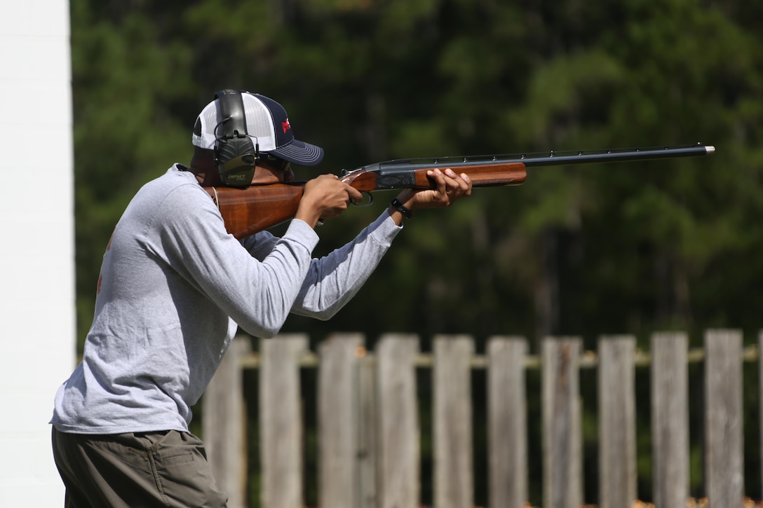 Staff Sgt. Harrison Porquin fires a rifle at a moving target during a skeet range at Marine Corps Air Station Cherry Point, N.C., Oct. 7, 2015. Marines with 2nd Low Altitude Air Defense Battalion held a weapons safety class and participated in the range as part of their Firearms Mentorship Program to promote proper weapons safety and education in a recreational manor. The program allows Marines to maintain their basic rifleman skills and receive further education on safety measures while handling weapons. Porquin is a warehouse chief with the battalion. (U.S. Marine Corps photo by Cpl. N.W. Huertas/Released)    