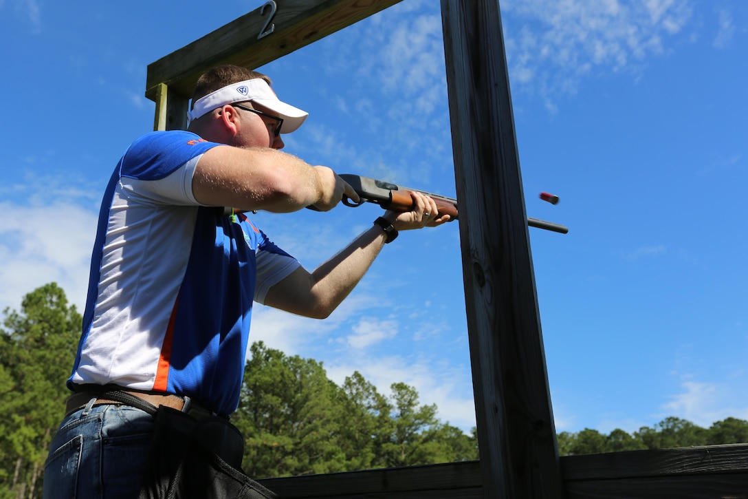 Lance Cpl. Austin Martin fires his rifle at a moving target during a skeet range at Marine Corps Air Station Cherry Point, N.C., Oct. 7, 2015. Marines with 2nd Low Altitude Air Defense Battalion held a weapons safety class and participated in the range as part of their Firearms Mentorship Program to promote proper weapons safety and education in a recreational manor. The program allows Marines to maintain their basic rifleman skills and receive further education on safety measures while handling weapons. Martin is a supply administration and operations clerk with the battalion. (U.S. Marine Corps photo by Cpl. N.W. Huertas/Released)    