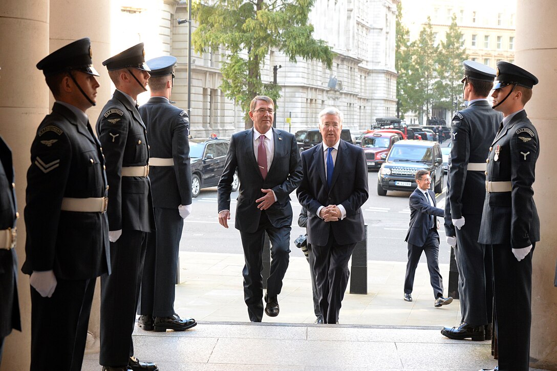 U.S. Defense Secretary Ash Carter walks with British Defense Secretary Michael Fallon at the Ministry of Defense in London, Oct. 9, 2015. Carter is finishing a five-day trip to Europe, where he attended the NATO Defense Ministerial Conference in Brussels and met with counterparts in Spain, Italy and the United Kingdom. DoD photo by U.S. Army Sgt. 1st Class Clydell Kinchen
