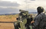 Soldiers, with the 1st Battalion, 204th Air Defense Artillery Regiment, Mississippi Army National Guard, emerge after a storm to prepare to fire a Stinger ground-to-air missile from an Avenger vehicle platform during a pre-deployment live-fire exercise on Fort Bliss, Texas, Oct. 7, 2015.