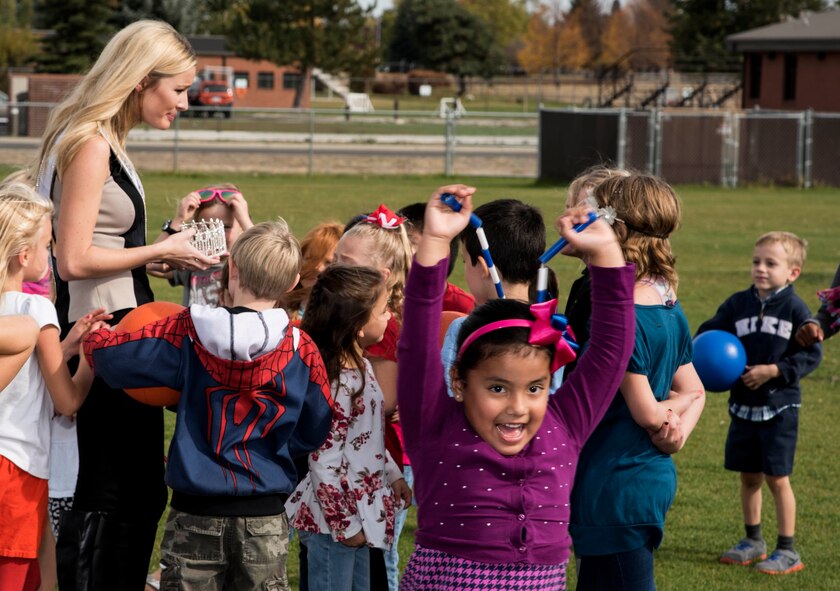 Kenzi Novell, Miss Washington, USA, shows her crown to Michael Anderson Elementary School students during a base tour Oct. 9, 2015, at Fairchild Air Force Base, Wash. Novell spent the day getting an inside look of the base to learn more about the mission. (U.S. Air Force photo/Airman 1st Class Sean Campbell)