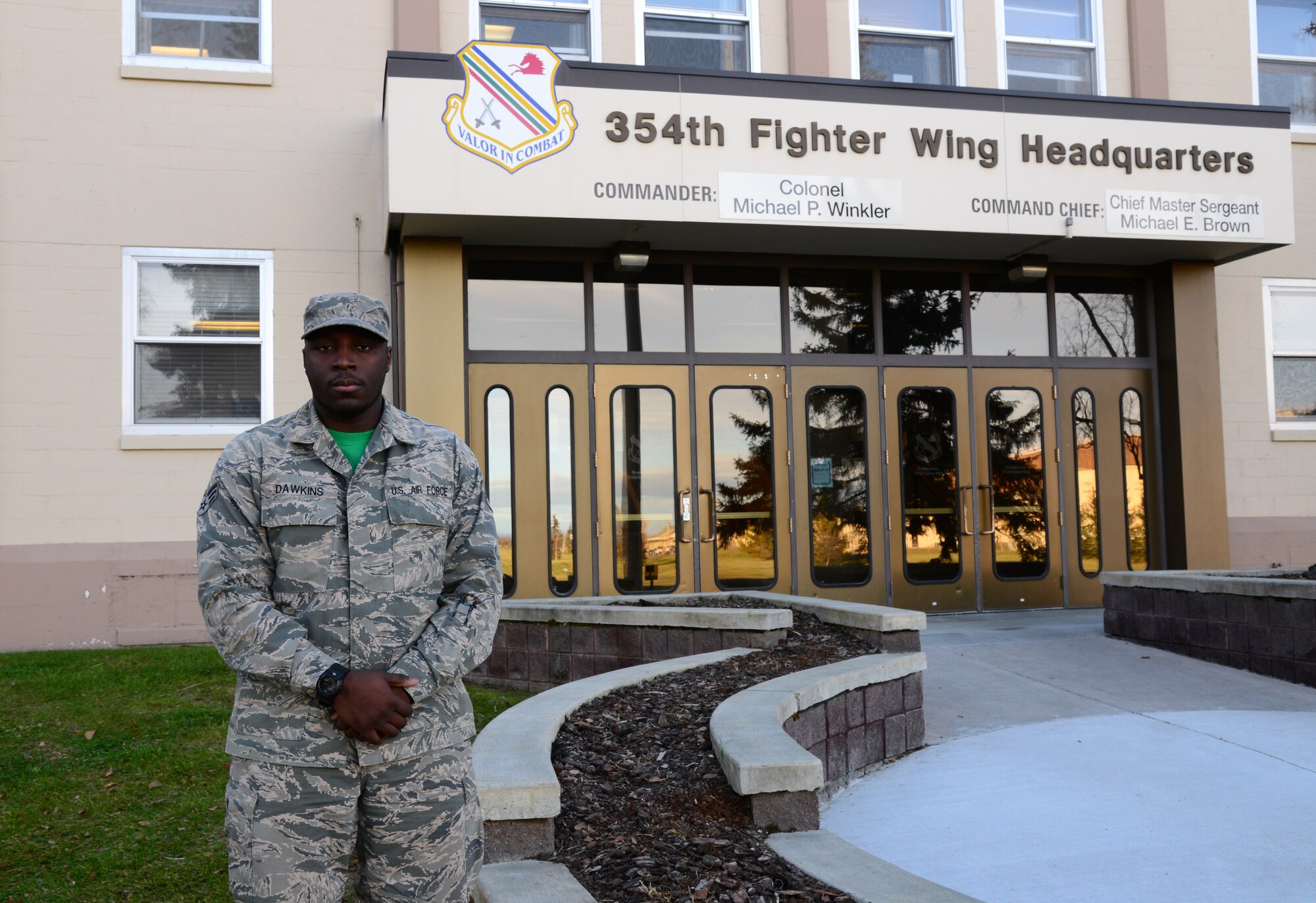 U.S. Air Force Senior Airman Devarius Dawkins, a 354th Force Support Squadron readiness and plans journeyman, takes a quick break outside Amber Hall, Oct. 9, 2015, at Eielson Air Force Base, Alaska. Dawkins said his favorite part of his job is working under pressure. (U.S. Air Force photo by Airman 1st Class Cassandra Whitman/Released)