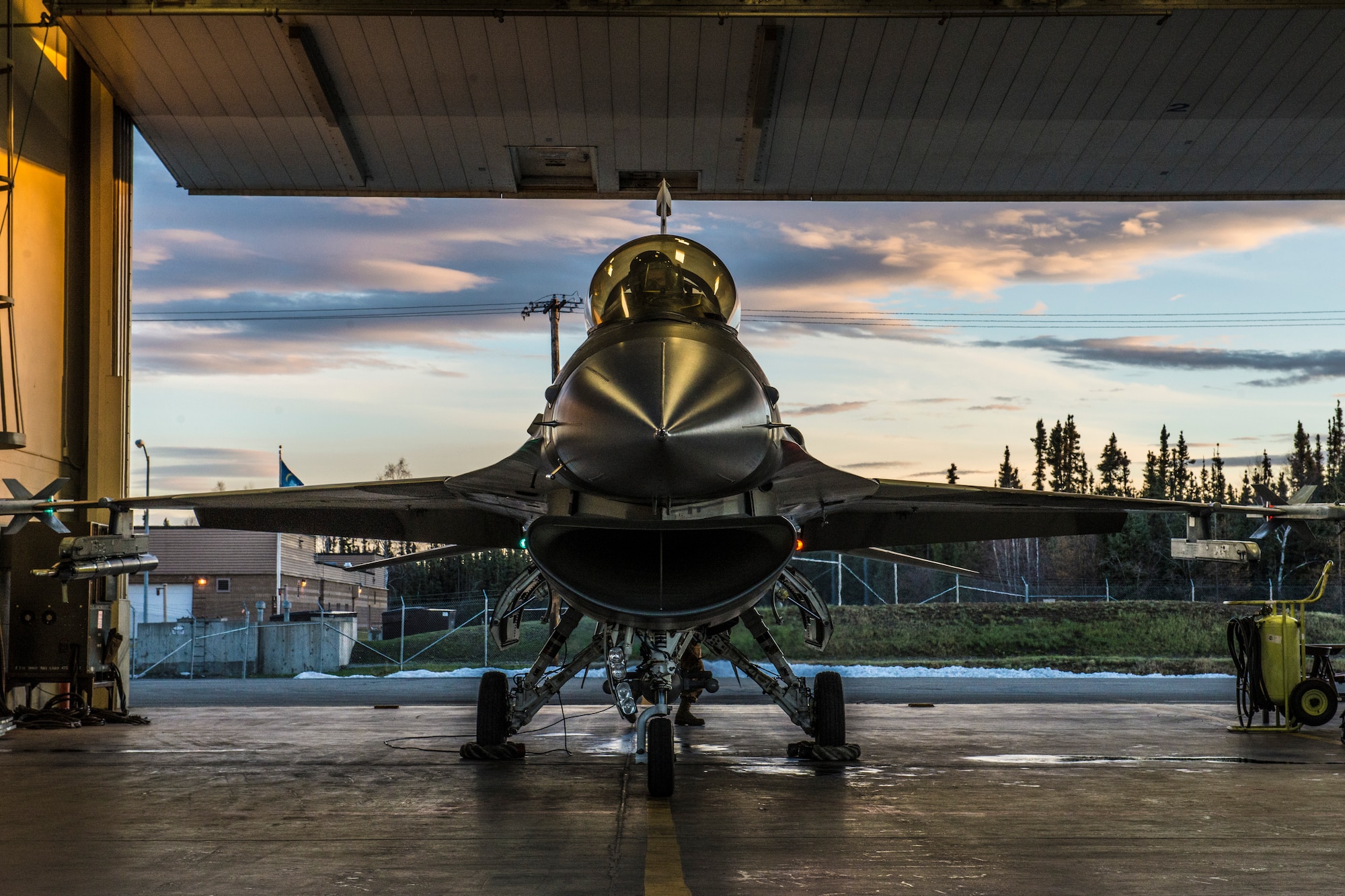 U.S. Air Force Senior Airman Terrence Lawrence, a 354th Aircraft Maintenance Squadron aircraft electrical and environmental systems journeyman, prepares an F-16 Fighting Falcon assigned to the 18th Aggressor Squadron at Eielson Air Force Base, Alaska, for a mission Oct. 8, 2015. Lawrence was the first Airman to complete a program called “cut training,” which cross utilizes Airmen to fill undermanned crew chief positions. (U.S. Air Force photo by Staff Sgt. Joshua Turner/Released)