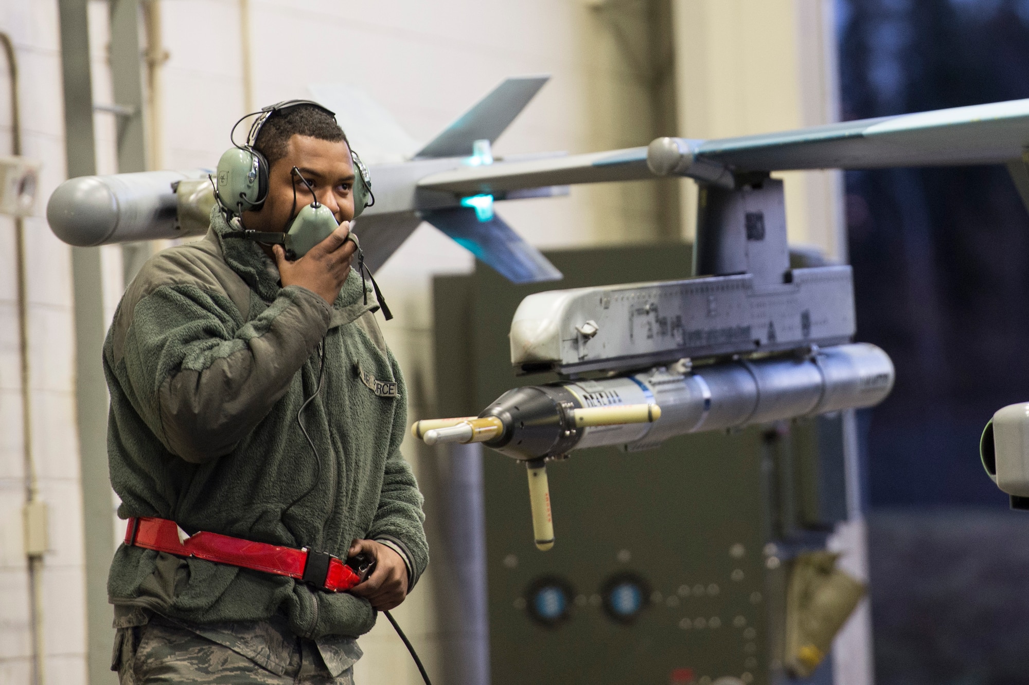 U.S. Air Force Senior Airman Terrence Lawrence, a 354th Aircraft Maintenance Squadron (AMXS) aircraft electrical and environmental systems journeyman, speaks to the maintainer in the cockpit of an F-16 Fighting Falcon assigned to the 18th Aggressor Squadron at Eielson Air Force Base, Alaska, prior to a mission Oct. 8, 2015. The 354th AMXS created a program called “cut training” to cross utilize Airmen to fill undermanned crew chief positions. Lawrence was the first Airman to complete the program. (U.S. Air Force photo by Staff Sgt. Joshua Turner/Released)