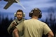 U.S. Air Force Senior Airman Terrence Lawrence, a 354th Aircraft Maintenance Squadron (AMXS) aircraft electrical and environmental systems journeyman, receives advice from Tech. Sgt. Glen Rathburn, a 354th AMXS maintainer, under the wing of an F-16 Fighting Falcon assigned to the 18th Aggressor Squadron at Eielson Air Force Base, Alaska, Oct. 8, 2015. Lawrence is cross utilized from a different maintenance career field to perform crew chief tasks because crew chiefs are undermanned 50 percent. (U.S. Air Force photo by Staff Sgt. Joshua Turner/Released)