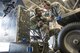 U.S. Air Force Senior Airman Terrence Lawrence and Staff Sgt. Eric Fitch, both 354th Aircraft Maintenance Squadron (AMXS) maintainers, talk about a problem with an F-16 Fighting Falcon aircraft assigned to the 18th Aggressor Squadron at Eielson Air Force Base, Alaska, Oct. 7, 2015. The 354th AMXS created a program called “cut training” to cross utilize Airmen to fill undermanned crew chief positions. Lawrence was the first Airman to complete the program. (U.S. Air Force photo by Staff Sgt. Joshua Turner/Released)