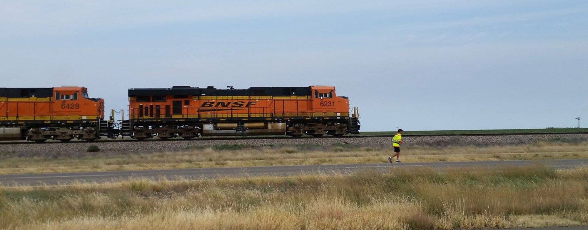 Master Sgt. Troy Drasher, 2nd Space Warning Squadron first sergeant, runs alongside a train on his way to Abilene, Texas, during Operation 720 Oct. 2, 2015, in Amarillo, Texas. Drasher is running from Aurora, Colorado, to Abilene, Texas, in order to raise money and awareness for wounded warriors. (Courtesy photo) 