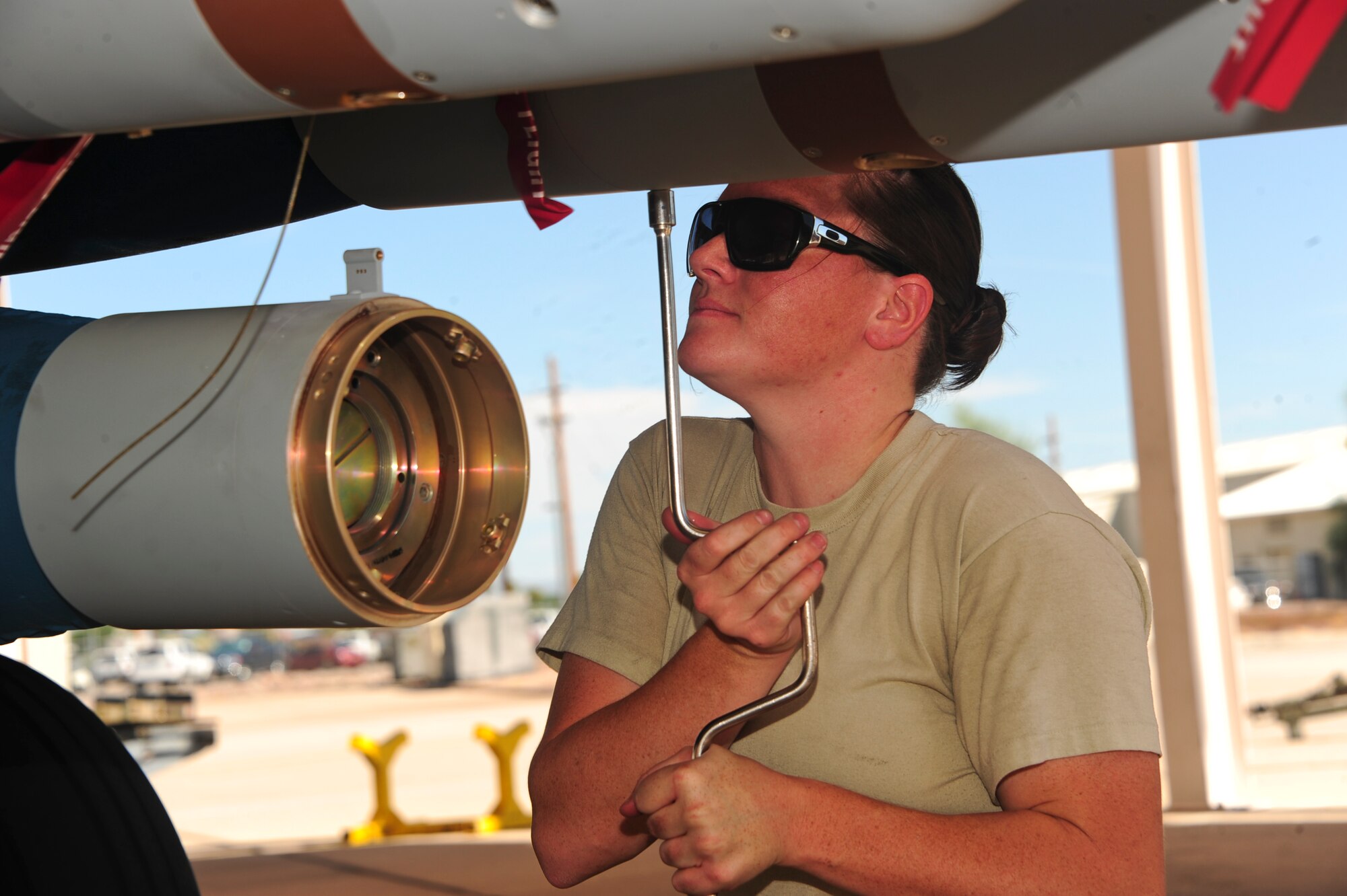 U.S. Air Force Senior Airman Bethany Lamb, 354th Aircraft Maintenance Unit load crew team member, places bolts in a computer control group during a load crew of the quarter contest at Davis-Monthan Air Force Base, Ariz., Oct. 2, 2015. The winners of the contest were announced at the 355th Aircraft Maintenance Squadron third Quarterly Awards ceremony. (U.S. Air Force photo by Airman Nathan Barbour/Released)