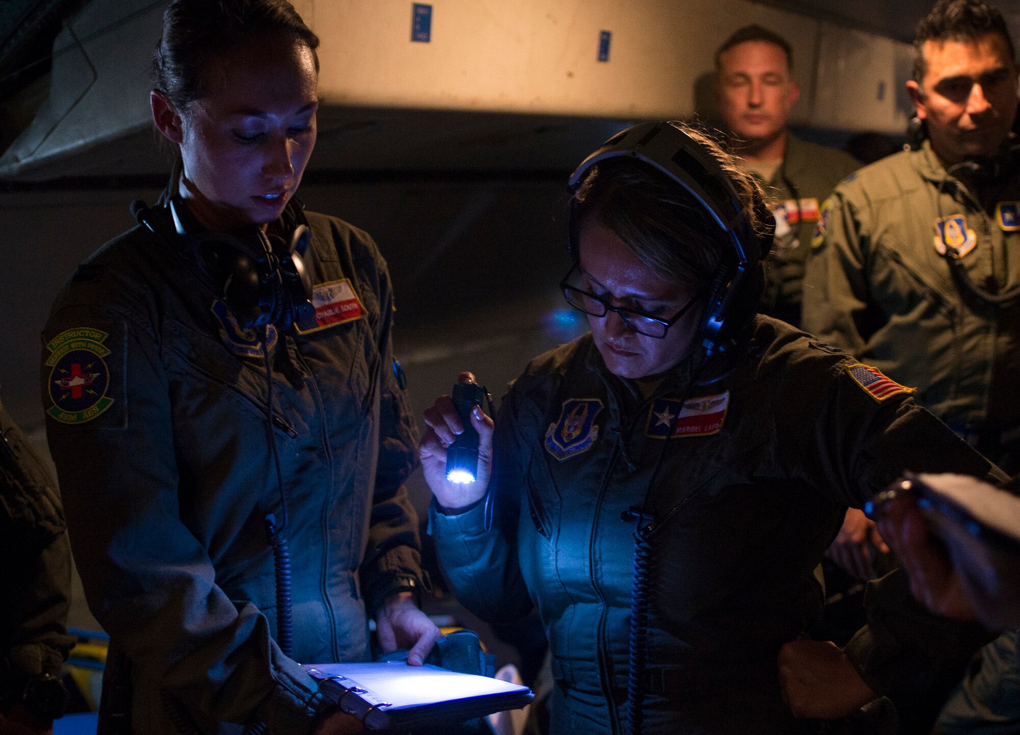 Capt. Charlie South and Capt. Maribel Lara, 433rd Aeromedical Evacuation Squadron medical nurses, review the C-5 litter configurations during a pre-flight briefing Oct. 7, 2015 at Joint Base San Antonio-Lackland, Texas. The 433rd AES training mission was the third training flight  in a series of five training evolution's. The primary objective of the flight is to establish aeromedical readiness for the C-5 and identify aeromedical evacuation crew member requirements. (U.S. Air Force photo by Benjamin Faske) (released)
