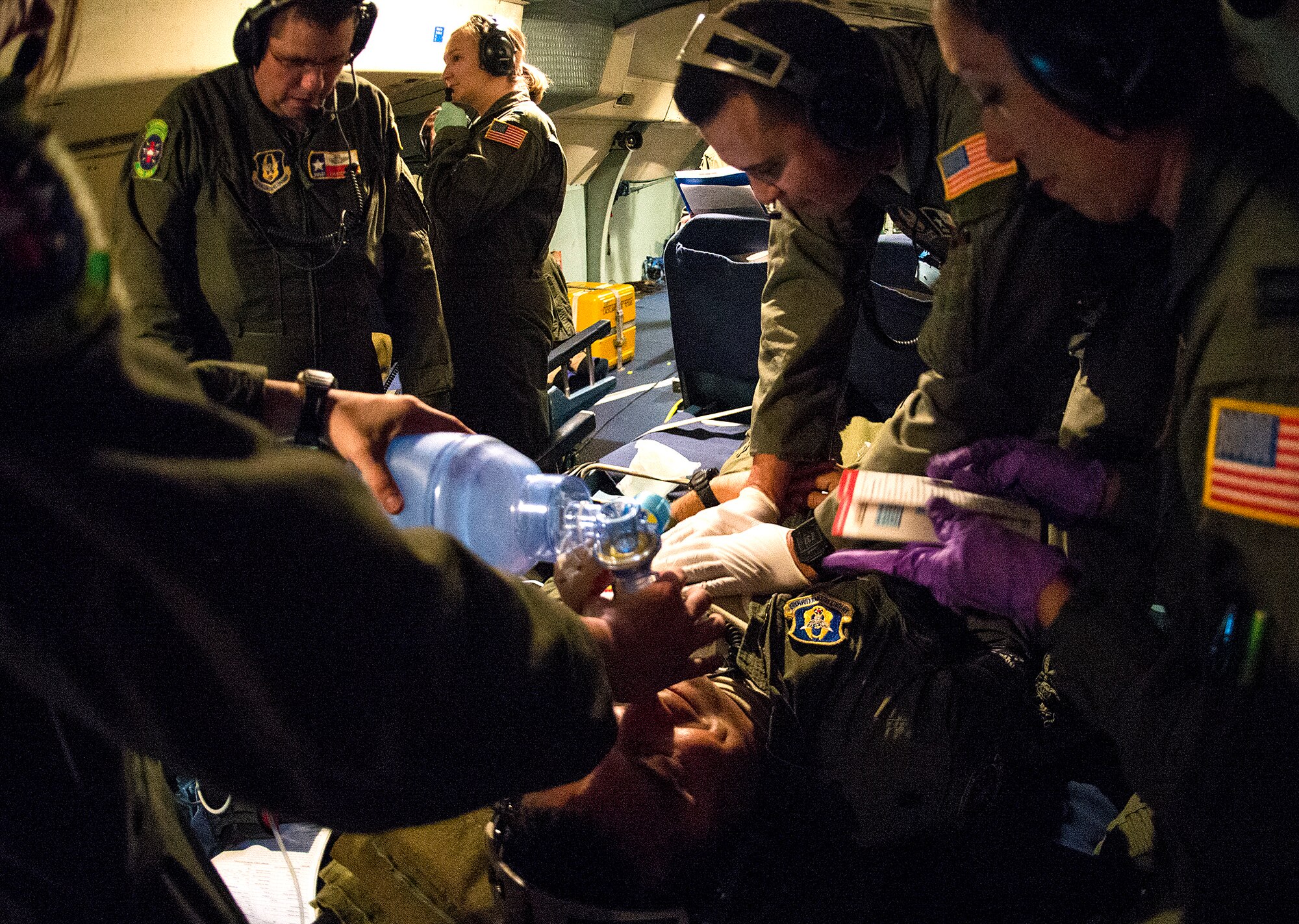 Members from the 433rd Aeromedical Evacuation Squadron perform simulated life saving techniques to a patient in cardiac arrest Oct. 7, 2015 at Joint Base San Antonio-Lackland, Texas. The 433rd AES training mission was the third training flight  in a series of five training evolutions. The primary objective of the flights is to establish aeromedical readiness for the C-5 and identify aeromedical evacuation crew member requirements. (U.S. Air Force photo by Benjamin Faske) (released)