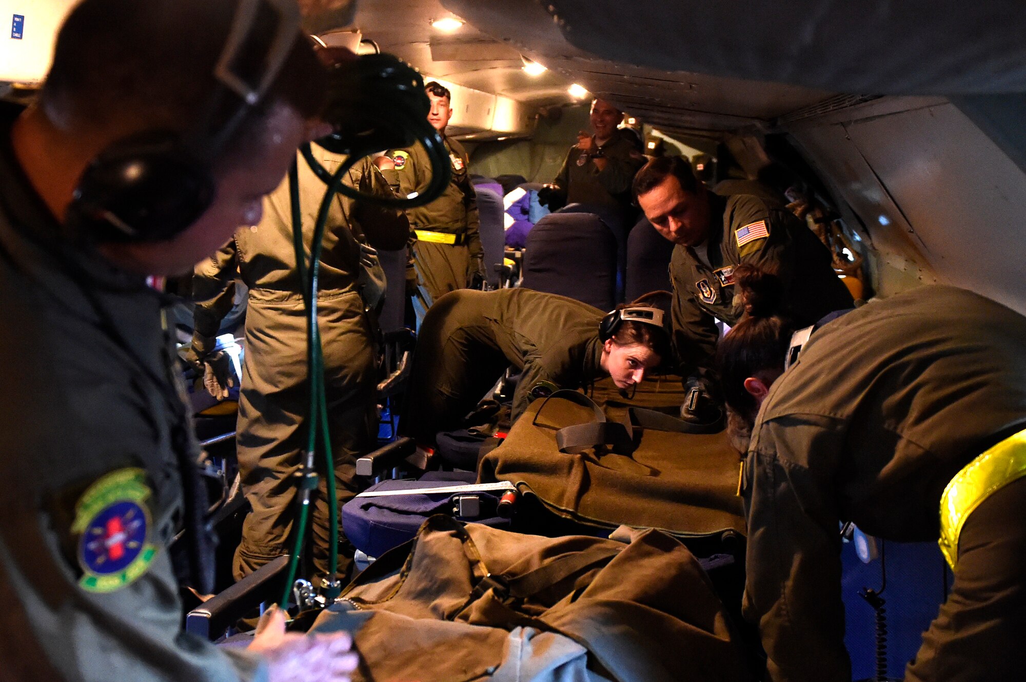 Members from the 433rd Aeromedical Evacuation Squadron prepare medical equipment to aide patients during a training scenario on-board a C-5 Galaxy aircraft Oct. 7, 2015 at Joint Base San Antonio-Lackland, Texas. Configuring a C-5 to meet their needs, the 433rd AES members established and met requirements to conduct Aeromedical Readiness Missions while maintaining the focus on the patient, significantly improving the efficiency and effectiveness of safe and responsive patients globally. (U.S. Air Force photo by Senior Airman Keith James/Released)
