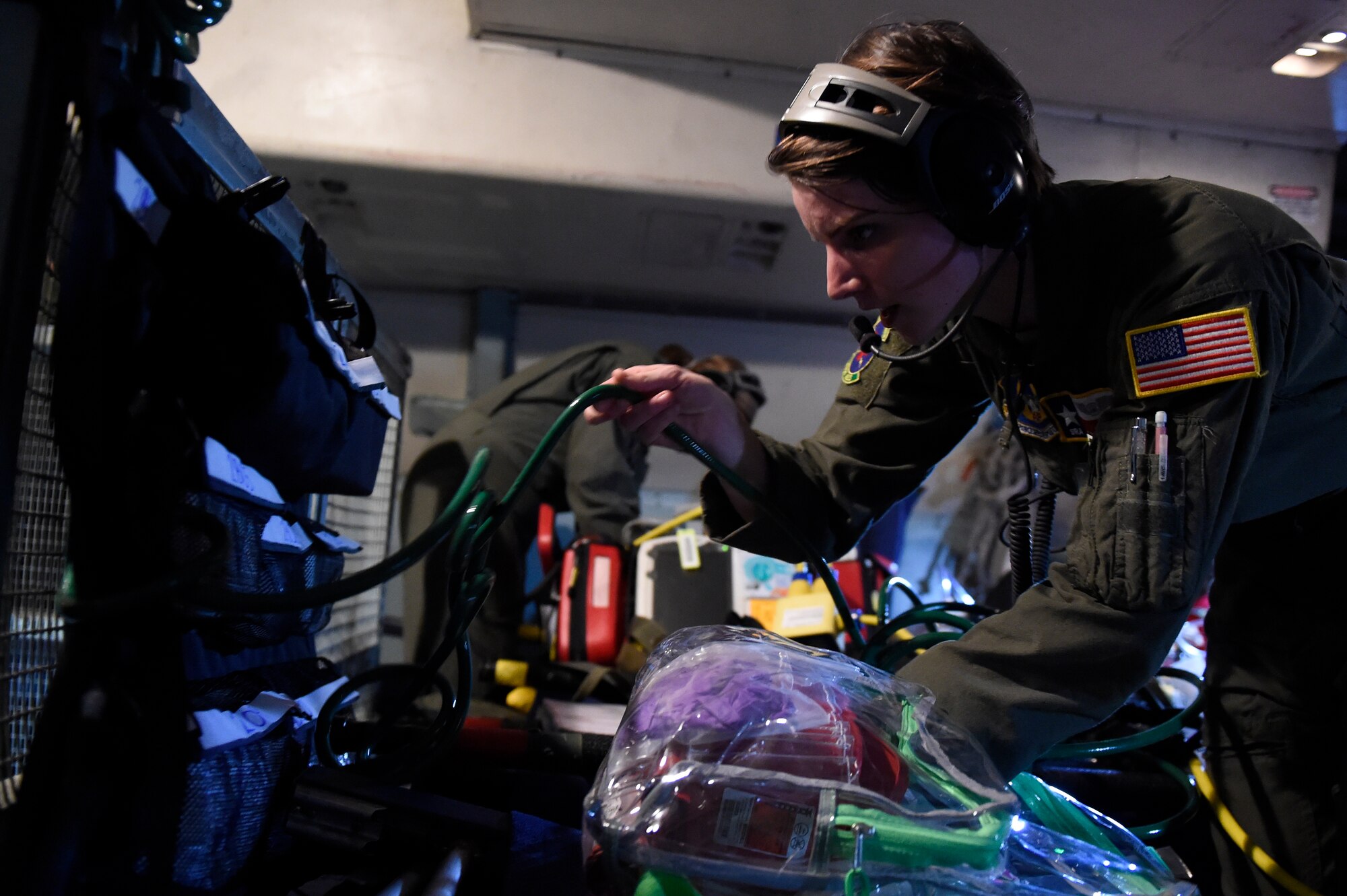 Senior Airman Sarah Clark, 433rd Aeromedical Evacuation Squadron medical technician, prepares medical equipment to aid patients during a training scenario aboard a C-5A Galaxy aircraft Oct. 7, 2015 at Joint Base San Antonio-Lackland, Texas. Configuring a C-5 to meet their needs, the 433rd AES members established and met requirements to conduct Aeromedical Readiness Missions while maintaining the focus on the patient, significantly improving the efficiency and effectiveness of safe and responsive patients globally. (U.S. Air Force photo by Senior Airman Keith James/Released)