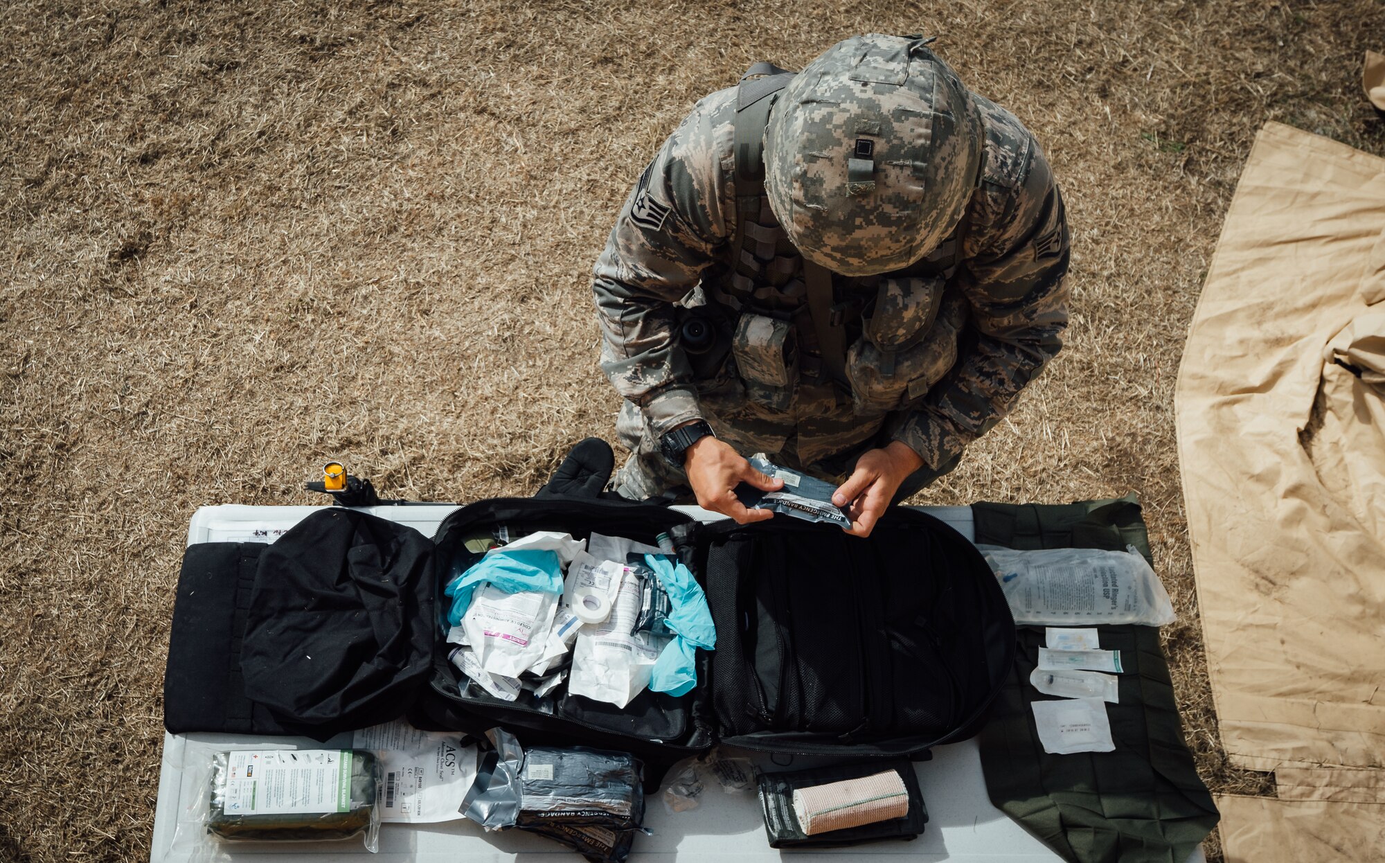 Staff Sgt. Kyle Bosshart, 446th Aeromedical Staging Squadron Expert Field Medic Badge candidate, packs a bag with medical supplies during the EFMB course at Joint Base Lewis-McChord, Wash., Sept. 24, 2015. The EFMB is the non-combat equivalent of the Combat Medical Badge and is awarded to medical personnel of the U.S. military who successfully complete a set of qualification tests. (U.S. Air Force photo by Senior Airman Jordan Castelan/Released)