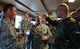 Chief master sergeant of the Estonian air force, Janis Jallai, explains the translation of a local restaurants name to 74th Expeditionary Fighter Squadron Airmen during an icebreaker event at Amari Air Base, Estonia, Oct. 1, 2015. The event was designed to bring the 74th EFS Airmen together with the NATO allies they will spend the next several months working alongside to build relationships and further develop interoperability. (U.S. Air Force photo by Andrea Jenkins/Released)
