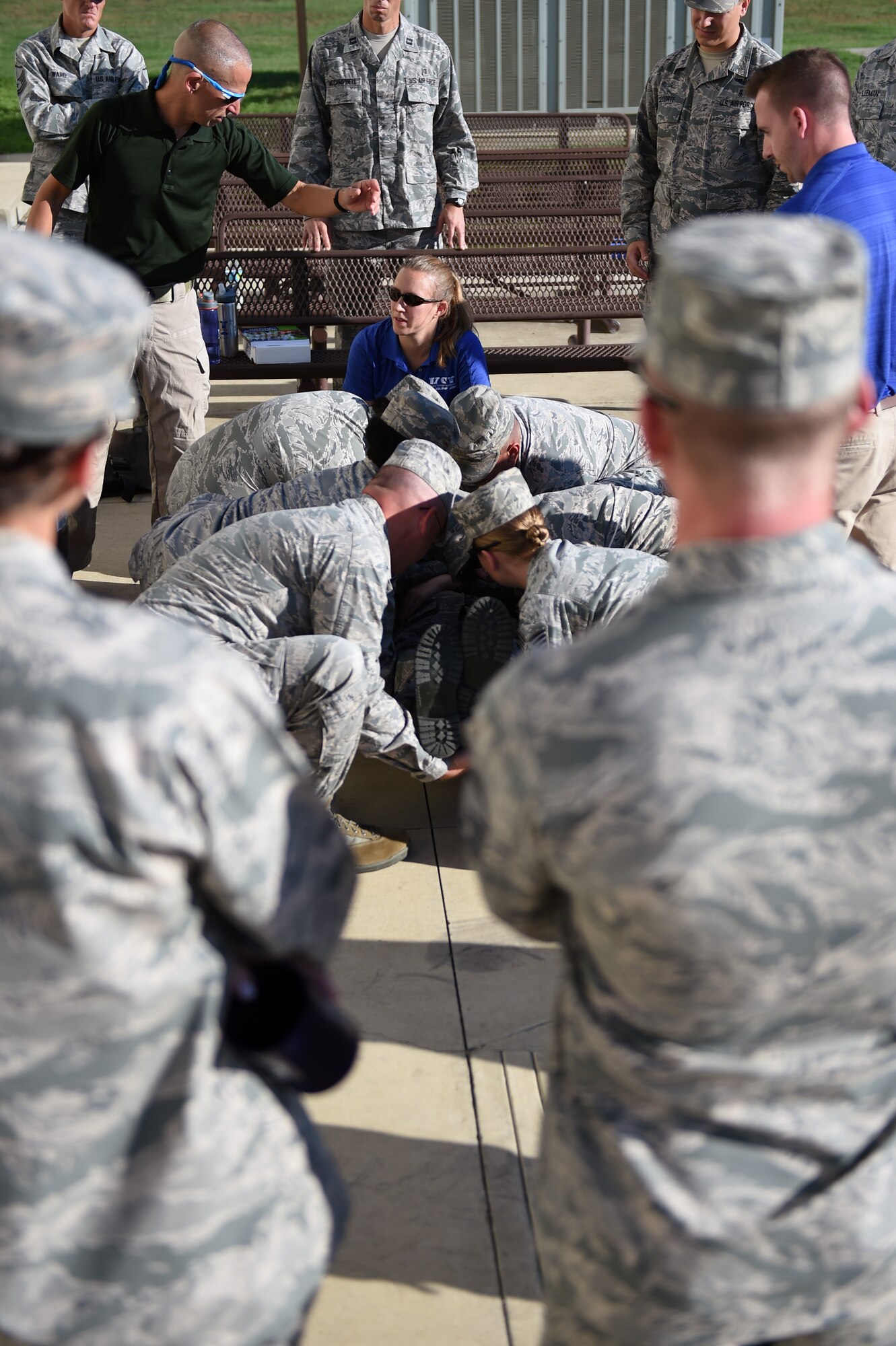 Dr. Douglas Casa, Dr. Rebecca Stearns, and Luke Belval of the Korey Stringer Institute instruct Air Force independent duty medical technicians on the proper way to handle someone who is experiencing heat stroke Sept. 29, 2015, at Joint Base San Antonio-Lackland. (U.S. Air Force photo/Staff Sgt. Jason Huddleston)