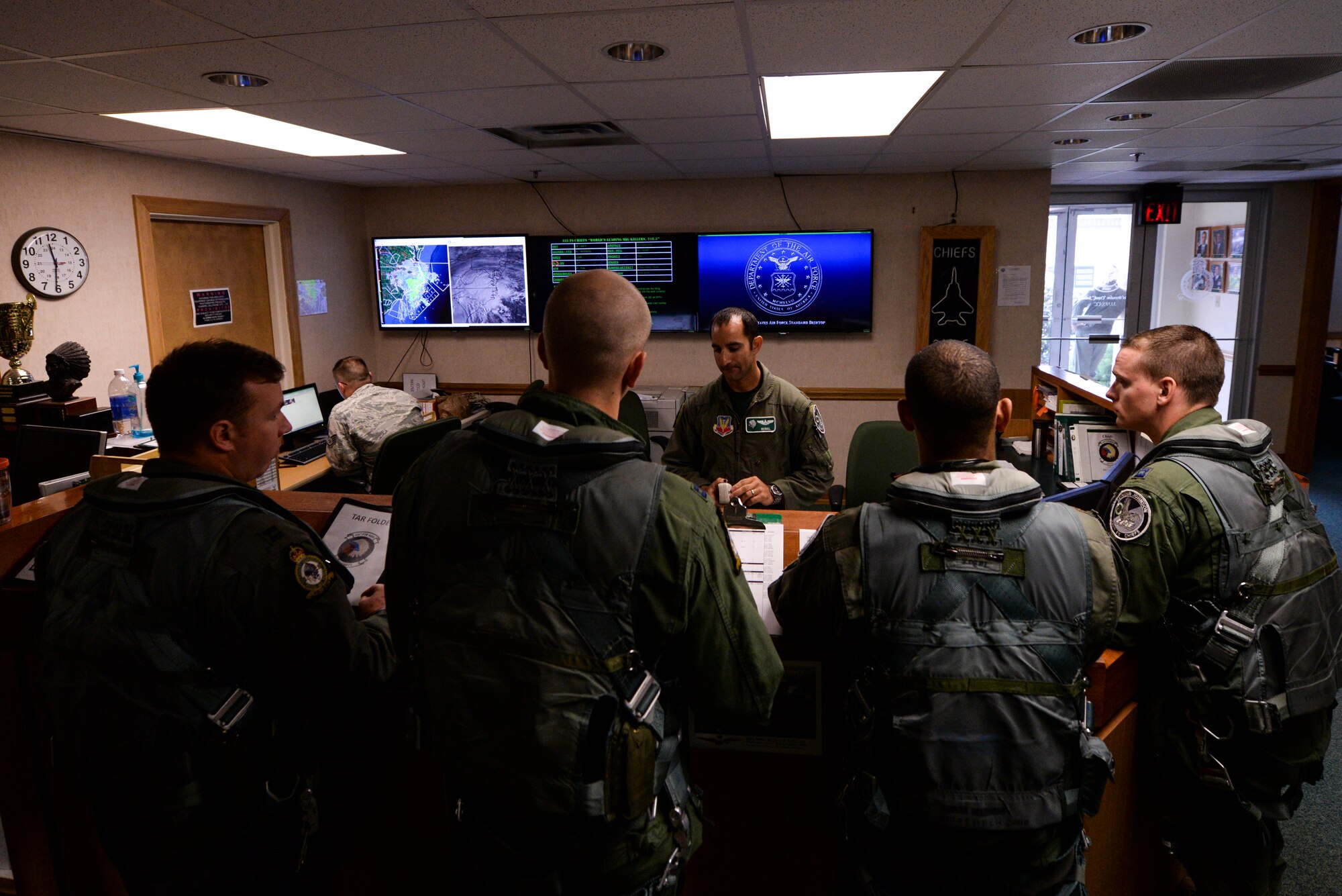F-15E Strike Eagle aircrew from the 335th Fighter Squadron receive a step brief prior to their flight in support of Operation Noble Eagle, Sept. 25, 2015, at Seymour Johnson Air Force Base, North Carolina. The aircrew provided air defense of temporary flight restrictions during Pope Francis’ visit to the U.S. (U.S. Air Force photo/Senior Airman Brittain Crolley)