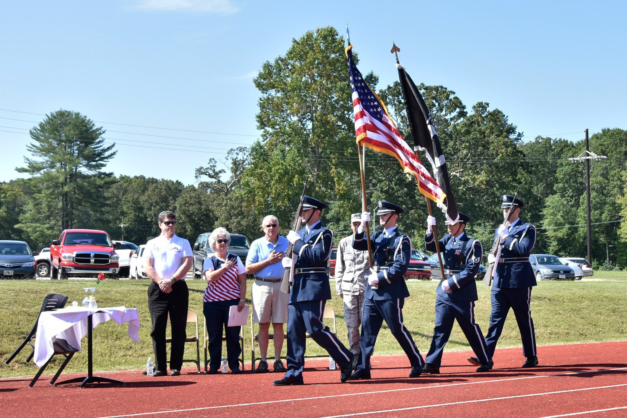 Bill Burkart III, far left, and Jo Anne Smith, second from left, prepare to speak at the AEDC POW/MIA Remembrance Day ceremony Sept. 16. Burkart spoke about his MIA father U.S. Air Force Col. Charles W. Burkart Jr. and Smith spoke about her MIA brother U.S. Air Force Maj. Bobby Marvin Jones, M.D. (Photo by Jacqueline Cowan)