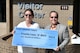 A donation was recently presented by the Arnold Community Council to assist the Franklin County Air Force Junior Reserve Officer's Training Corps in providing cadets with materials for the new school year. Pictured is Julie Campbell, AF JROTC parent volunteer, accepting a check from ACC President Jim Jolliffe.