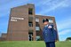 MCGHEE TYSON AIR NATIONAL GUARD BASE, Tenn. - Retired Chief Master Sgt. George A. Vitzthum stands by the building in his name that was dedicated here Oct 8, 2015, with a celebration and ceremony with I.G. Brown Training and Education Center staff, friends and family. (U.S. Air National Guard photo by Master Sgt. Jerry Harlan/Released)