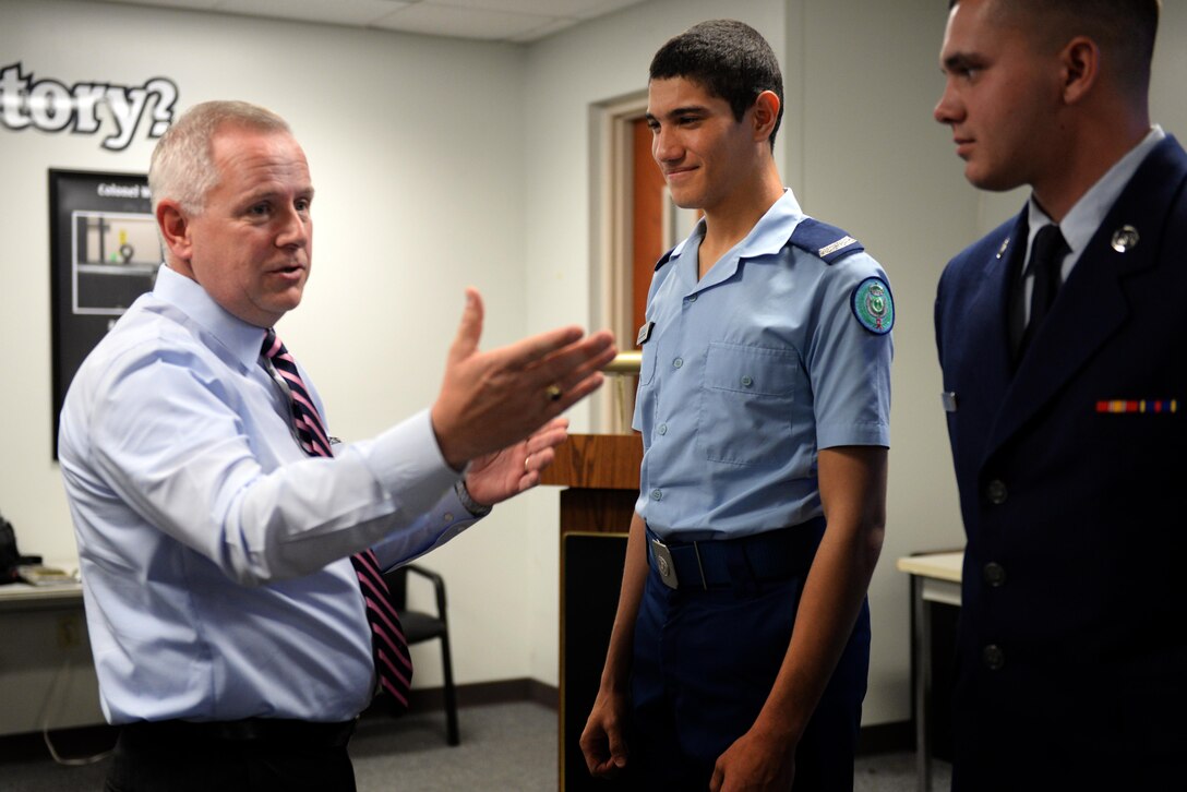 Ralph Taylor, 82nd Training Wing chief international military student officer, congratulates the graduates of the 361st Training Squadron aerospace propulsion course Oct. 7, 2015, at Sheppard Air Force Base, Texas.  This class was a joint class with members of the U.S. Air Force and the Royal Saudi Air Force. RSAF airman Abdulgader Baeraqi is the first to complete both the English Language Training course and technical training exclusively at Sheppard. (U.S. Air Force photo/Tech. Sgt. Mike Meares)