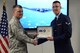 Maj. Adam MacKenzie, 361st Training Squadron commander, presents Airman 1st Class Andrew Richter, 361st TRS aerospace propulsion graduate, with the ACE award during the class graduation at Sheppard Air Force Base, Texas, Oct. 7, 2015.  Richter earned the ACE award for maintaining a perfect score through the entire seven blocks of course instruction. (U.S. Air Force photo/Tech. Sgt. Mike Meares)