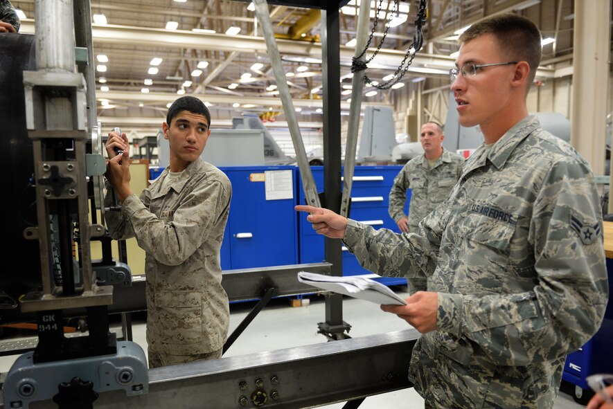 Airman 1st Class Andrew Richter, 361st TRS aerospace propulsion graduate, quizzes his fellow classmates just hours before their final block examination in the aerospace propulsion course at Sheppard Air Force Base, Texas, Oct. 1, 2015.  Richter, graduated Oct. 7 as an ACE award recipient for maintaining a perfect score through the entire seven blocks of course instruction. (U.S. Air Force photo/Tech. Sgt. Mike Meares)