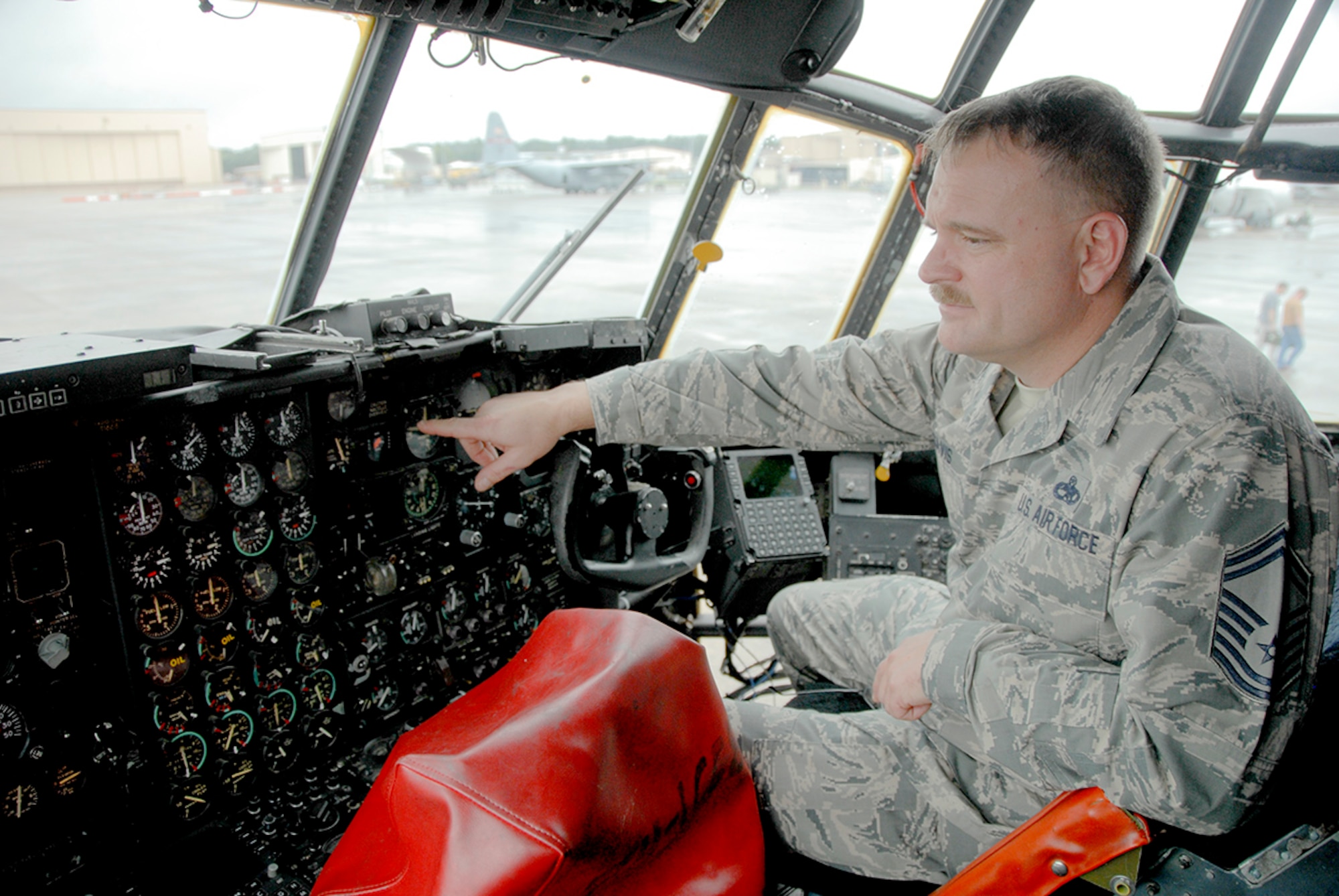 Senior Master Sgt. Shawn Davis, 373rd Training Squadron, Detachment 6 chief, checks out the flight deck of the new C-130H. The aircraft will be permanently moved to a training pad on base. The Sept. 29 arrival of a retired  C-130H will not only enable maintenance professionals across Robins to have a dedicated aircraft for training purposes, but it will be a welcome addition to the two F-15s that no longer have to sit by themselves in the 402nd Aircraft Maintenance Group’s aircraft training pad. The 373rd is one of many Air Education and Training Command field training detachments assigned to the 982nd Training Group at Sheppard Air Force Base, Texas. (U.S. Air Force photo by Misuzu Allen)

