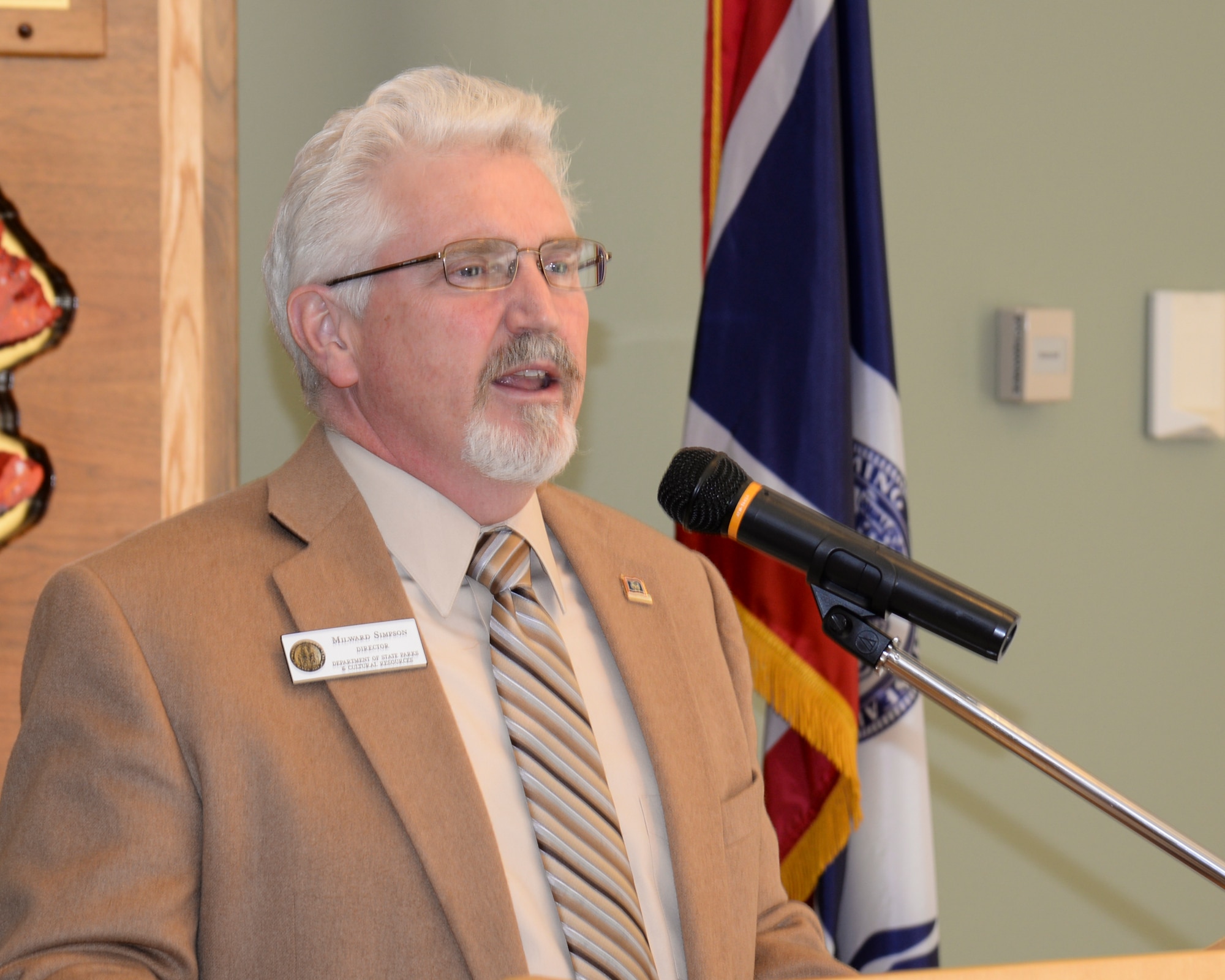 Milward Simpson, director of the Wyoming Department of State Parks and Cultural Resources, speaks at an event in the Wyoming State Museum in Cheyenne, Wyo., Oct. 5, 2015. Simpson and Col. Stephen Kravitsky, 90th Missile Wing commander, attended the event to sign an amendment to an agreement between F.E. Warren Air Force Base, Wyo., and the state regarding the historical preservation of a deactivated Peacekeeper Missile site. (U.S. Air Force photo by Senior Airman Jason Wiese)