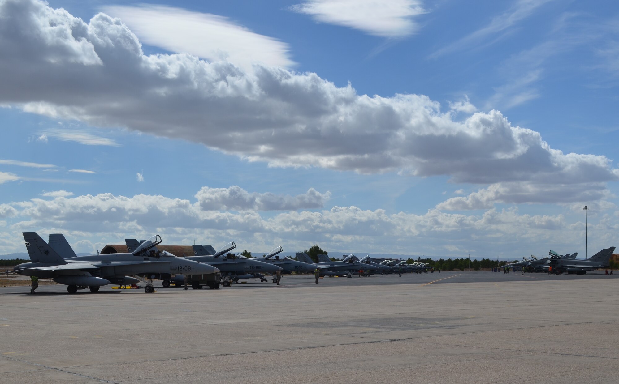 Crews and pilots from seven allied countries prepare various fighter aircraft for take-off during the final week of the NATO Tactical Leadership Programme in Albacete, Spain, Oct. 8. Throughout the program, NATO and allied pilots prepared to become mission commanders by leading coalition strike packages and by instructing allied flying and non-flying personnel in matters related to tactical air operations. (U.S. Air Force Photo by Capt. Sybil Taunton/Released)