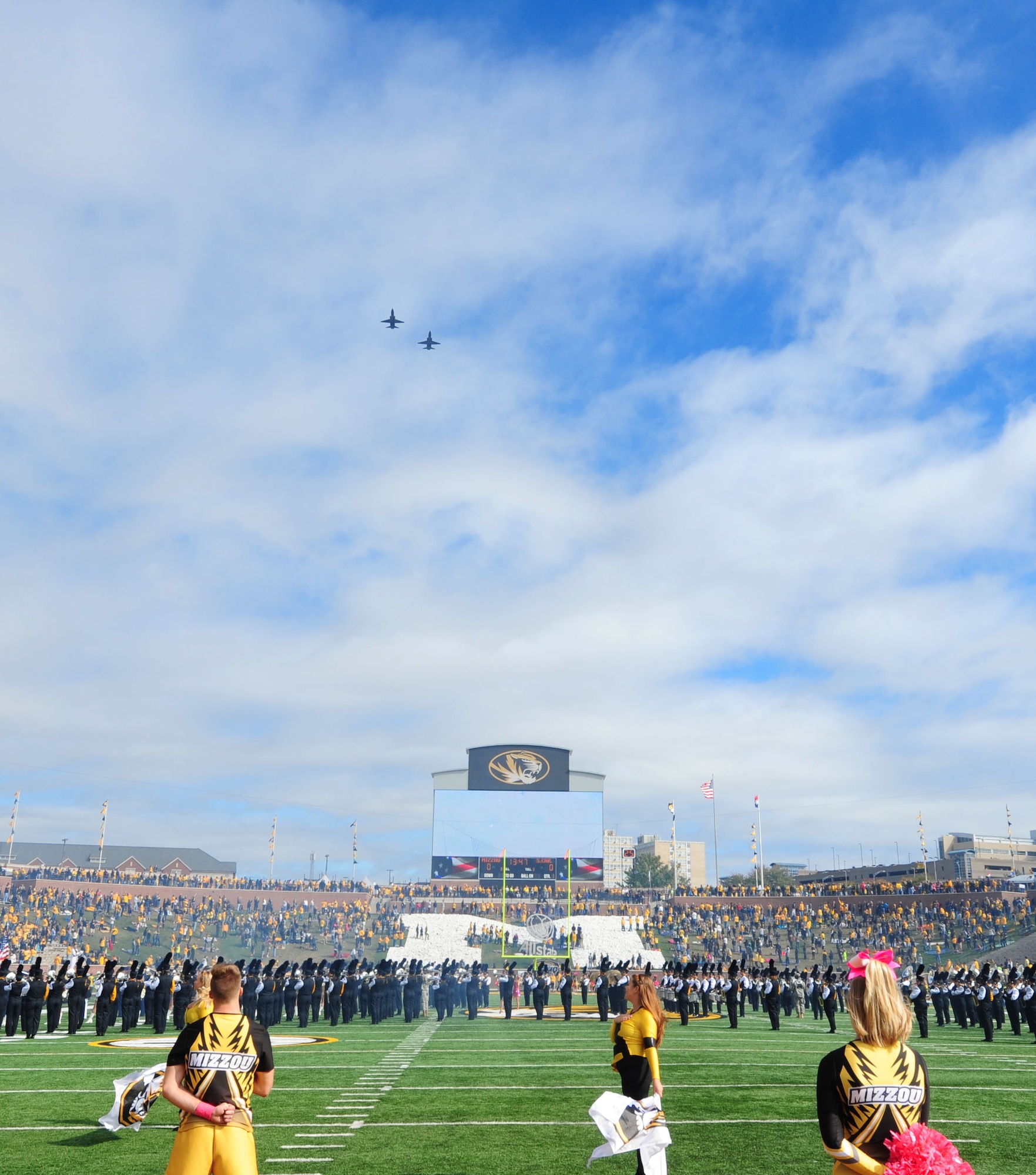 Two T-38 Talons perform a flyover at the University of Missouri football game Oct. 3, 2015, in Columbia, Mo. More than 500 members from Team Whiteman attended the military appreciation game at Mizzou. (U.S. Air Force photo by Airman 1st Class Jazmin Smith/Released)