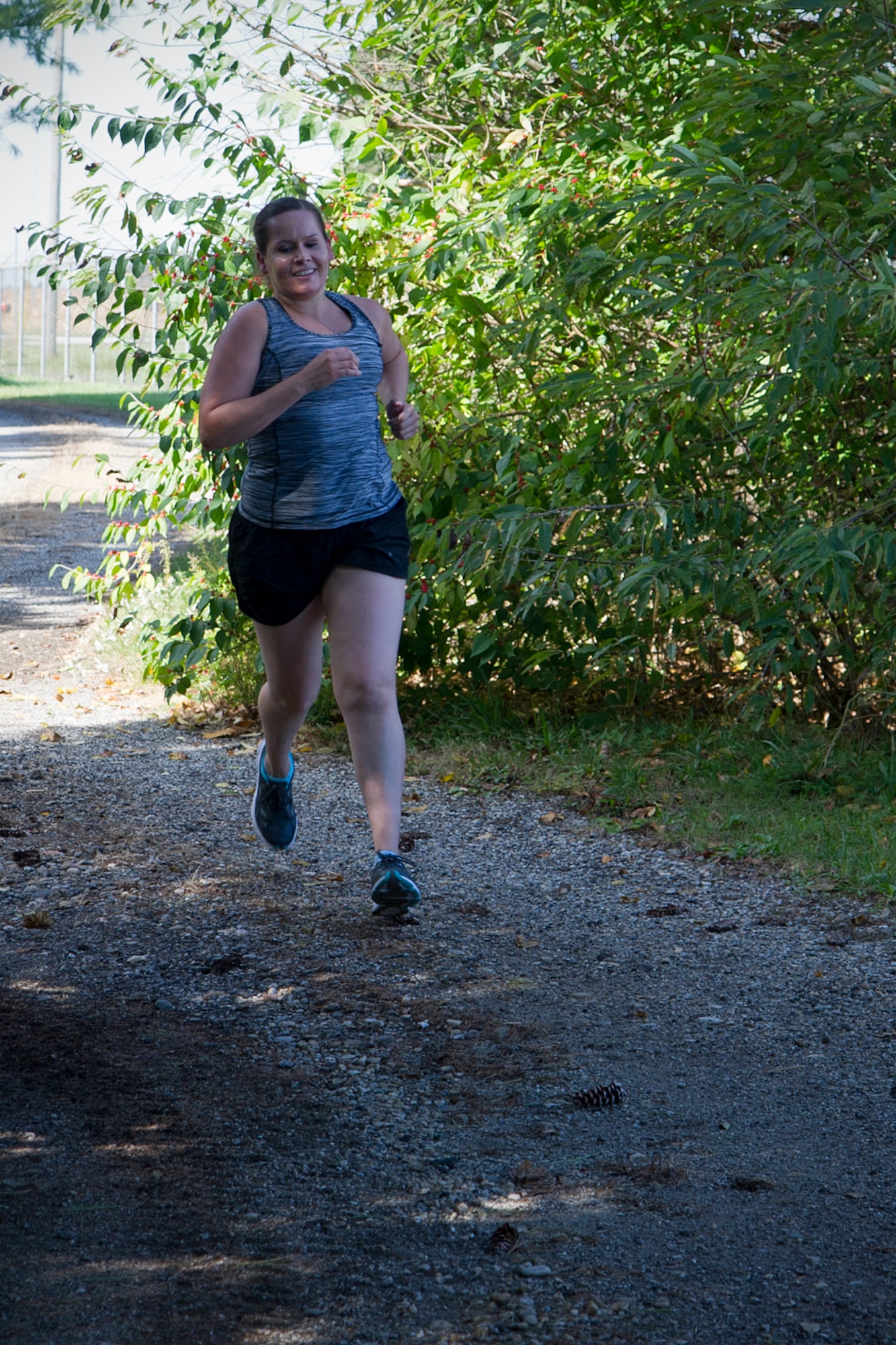 Kirsten O’Brien, 434th Aerospace Medicine Squadron medical technician, weaves through a section of forested trail during a Fall Foliage 5K and walk at Grissom Air Reserve Base, Ind., Sept. 30, 2015. Hosted by the 434th Force Support Squadron fitness center, the 3.1-mile course took runners around the western perimeter of the base. (U.S. Air Force photo/Senior Airman Katrina Heikkinen)