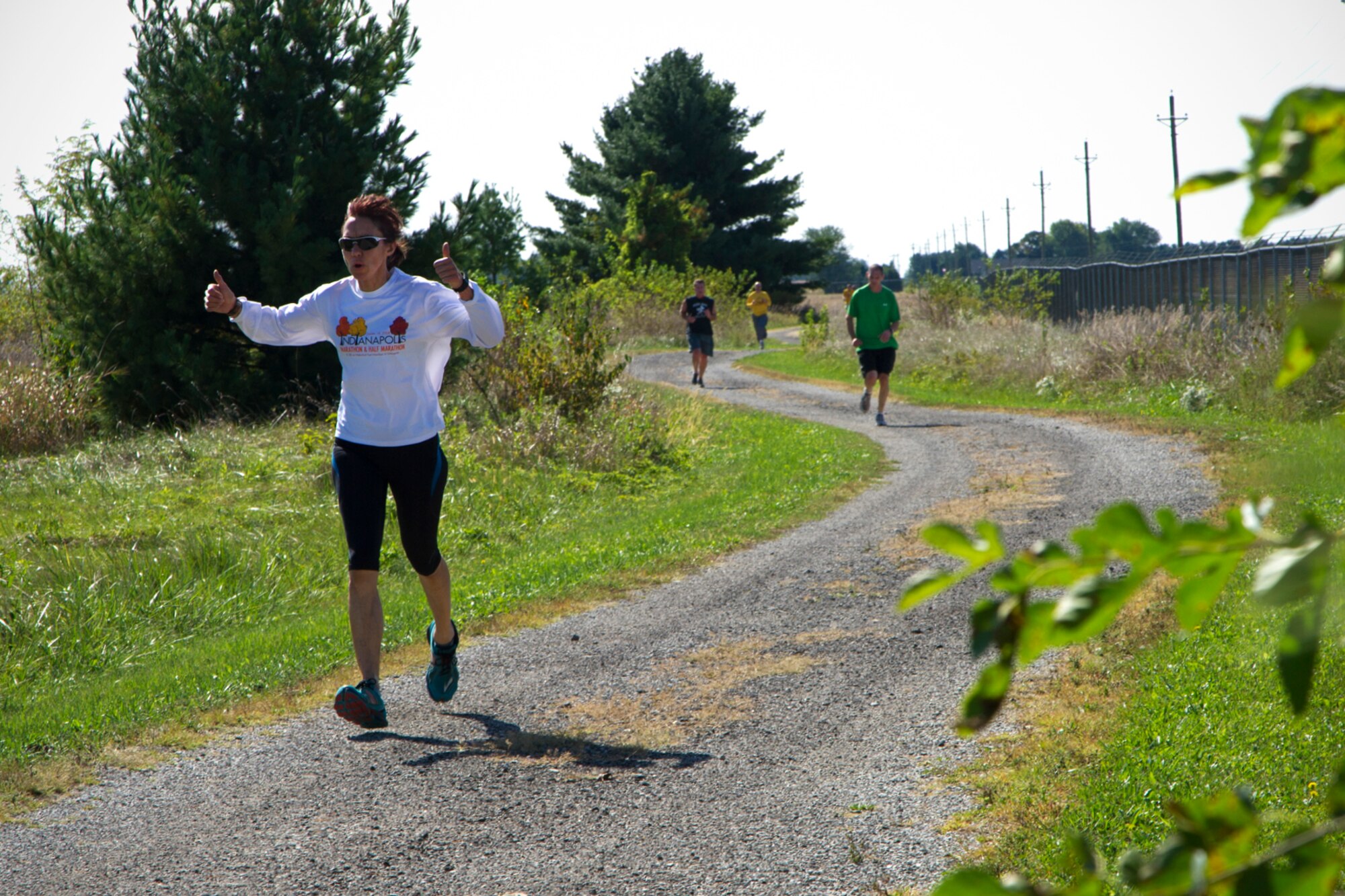 Patricia Latham, 434th Air Refueling Wing management analyst, gives a thumbs up during a Fall Foliage 5K at Grissom Air Reserve Base, Ind., Sept. 30, 2015. While some participants enjoyed the scenic route at a leisurely pace, Anthony Strzalka, 434th Civil Engineer Squadron Explosive Ordnance Disposal, finished the 3.1-mile race in first place, with a time of 19 minutes and 30 seconds. (U.S. Air Force photo/Senior Airman Katrina Heikkinen)