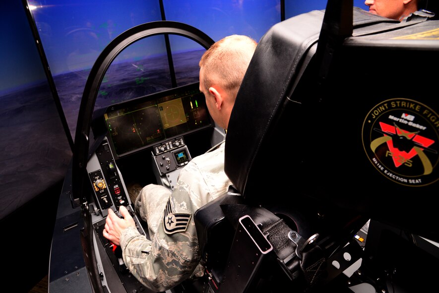 Staff Sgt. Joseph Howard, 51st Operations Support Squadron air traffic controller, sits inside the F-35 Lightning II demonstrator Oct. 8, 2015, at Osan Air Base, Republic of Korea. Members from across base were able to come out and experience what flying an F-35 would be like. (U.S. Air Force photo by Staff Sgt. Benjamin Sutton)