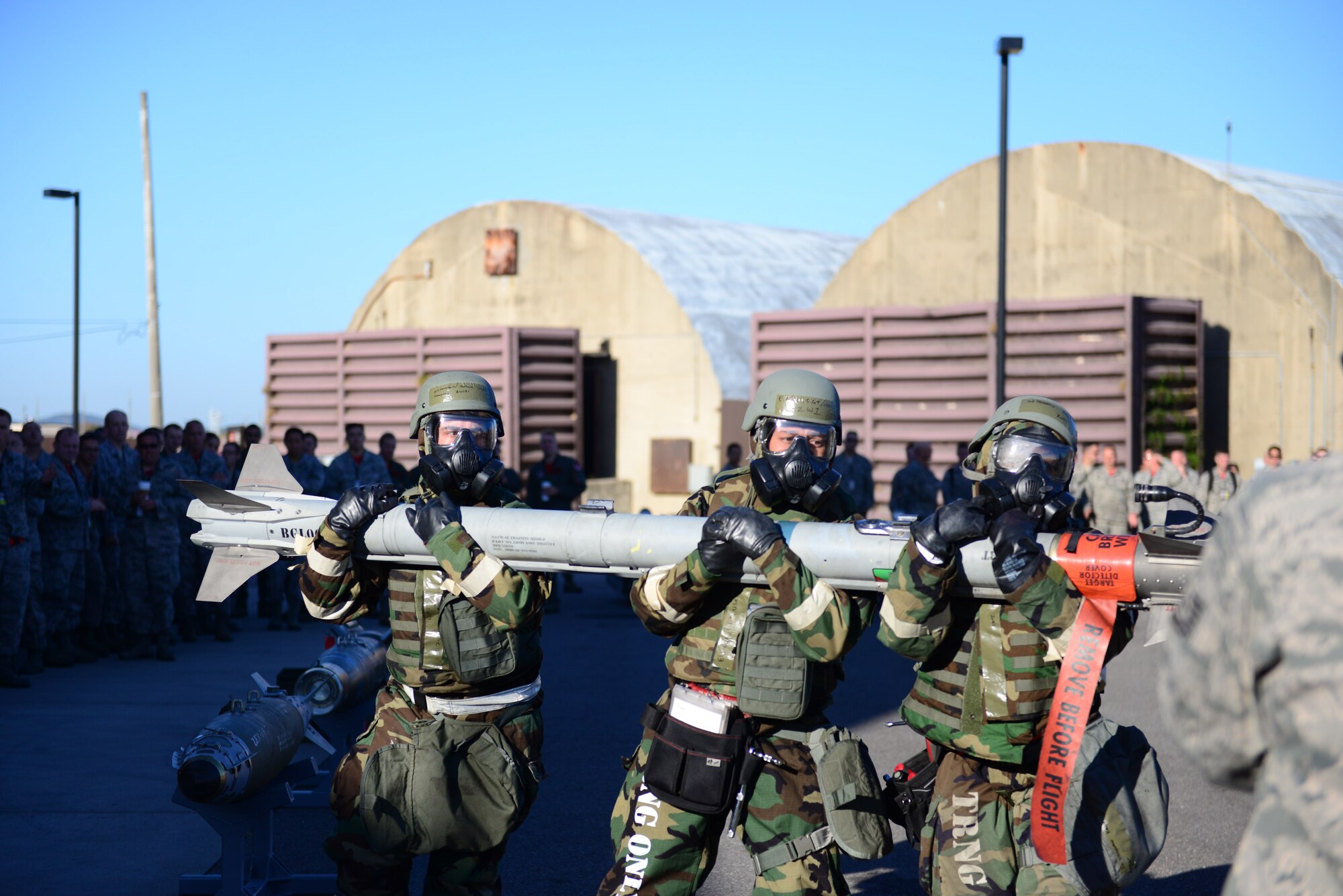 The 36th Aircraft Maintenance Unit load team carries a dummy air-to-air missile to their F-16 Fighting Falcon during the quarterly load competition held at Osan Air Base, Republic of Korea, Oct. 9, 2015. This quarter the competitors completed the reload portion with the added difficulty of being in mission-oriented protective postures gear and even simulated a gas attack where they had to don full MOPP 4 before continuing.
(U.S. Air Force photo/Staff Sgt. Amber Grimm)