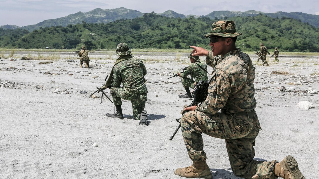 Philippine Marines and U.S. Marines work together to take down a simulated enemy force during squad attack training at Crow Valley, Philippines, Oct. 4, 2015. Philippine Marines and U.S. Marines with Battalion Landing Team 2nd Battalion, 5th Marine Regiment, 31st Marine Expeditionary Unit, are training side by side for Amphibious Landing Exercise 2015, an annual bilateral training exercise conducted by members of the Armed Forces of the Philippines alongside U.S. Marine and Navy Forces. 