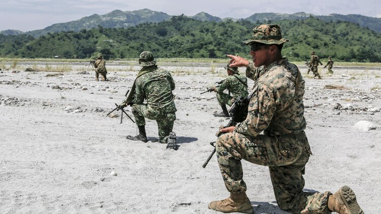 Philippine Marines and U.S. Marines work together to take down a simulated enemy force during squad attack training at Crow Valley, Philippines, Oct. 4, 2015. Philippine Marines and U.S. Marines with Battalion Landing Team 2nd Battalion, 5th Marine Regiment, 31st Marine Expeditionary Unit, are training side by side for Amphibious Landing Exercise 2015, an annual bilateral training exercise conducted by members of the Armed Forces of the Philippines alongside U.S. Marine and Navy Forces. 