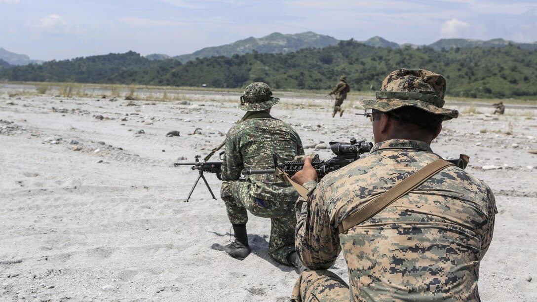 Philippine Marines and U.S. Marines execute squad attacks at Crow Valley, Philippines, Oct. 4, 2015. Philippine Marines and U.S. Marines with Battalion Landing Team 2nd Battalion, 5th Marine Regiment, 31st Marine Expeditionary Unit, are training side by side for Amphibious Landing Exercise 2015, an annual bilateral training exercise conducted by members of the Armed Forces of the Philippines alongside U.S. Marine and Navy Forces. 