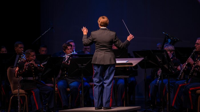 Chief Warrant Officer 3 Stephanie Wire, the officer in charge of the 1st Marine Division Band, conducts the band during the “Honor our Fallen” concert at the Marines Memorial Club and Hotel in San Francisco, Oct. 8, 2015, as part of San Francisco Fleet Week 2015. The concert was an hour-long performance honoring the fallen Marines who have given the ultimate sacrifice during every conflict the Marine Corps has fought in.