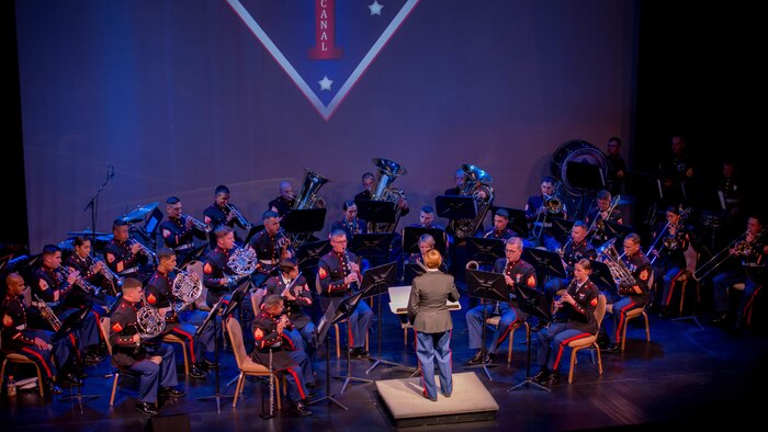 Chief Warrant Officer 3 Stephanie Wire, the officer in charge of the 1st Marine Division Band, conducts the band during the “Honor our Fallen” concert at the Marines Memorial Club and Hotel in San Francisco, Oct. 8, 2015, as part of San Francisco Fleet Week 2015. The concert was an hour-long performance honoring the fallen Marines who have given the ultimate sacrifice during every conflict the Marine Corps has fought in.