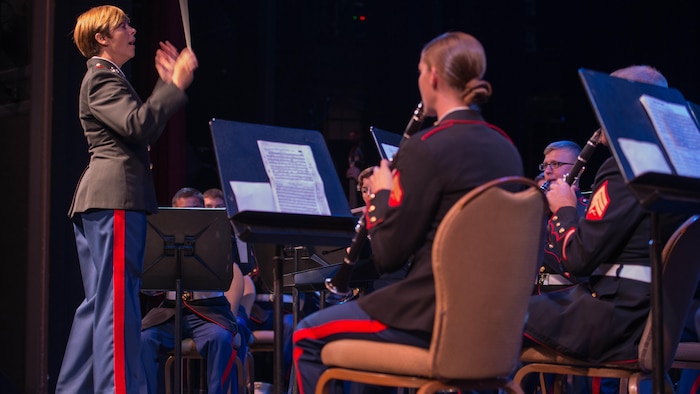Chief Warrant Officer 3 Stephanie Wire, the officer in charge of the 1st Marine Division Band, conducts the band during the “Honor our Fallen” concert at the Marines Memorial Club and Hotel in San Francisco Oct. 8, 2015, as part of San Francisco Fleet Week 2015. The concert was an hour-long performance honoring the fallen Marines who have given the ultimate sacrifice during every conflict the Marine Corps has fought in.