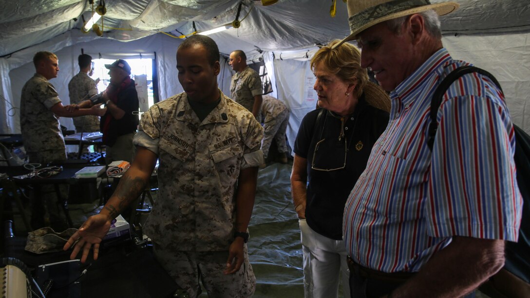 Seaman Tyler Johnson, a corpsman with 1st Medical Battalion, 1st Marine Logistics Group, explains medical procedures to San Francisco natives during a humanitarian assistance and disaster relief static display at Marina Green Park, San Francisco, Oct. 9, 2015 as part of San Francisco Fleet Week 2015. SFFW 15’ is a week-long event that blends a unique training and education program, bringing together key civilian emergency responders and Naval crisis-response forces to exchange best practices focused on humanitarian assistance disaster relief with particular emphasis on defense support to civil authorities.