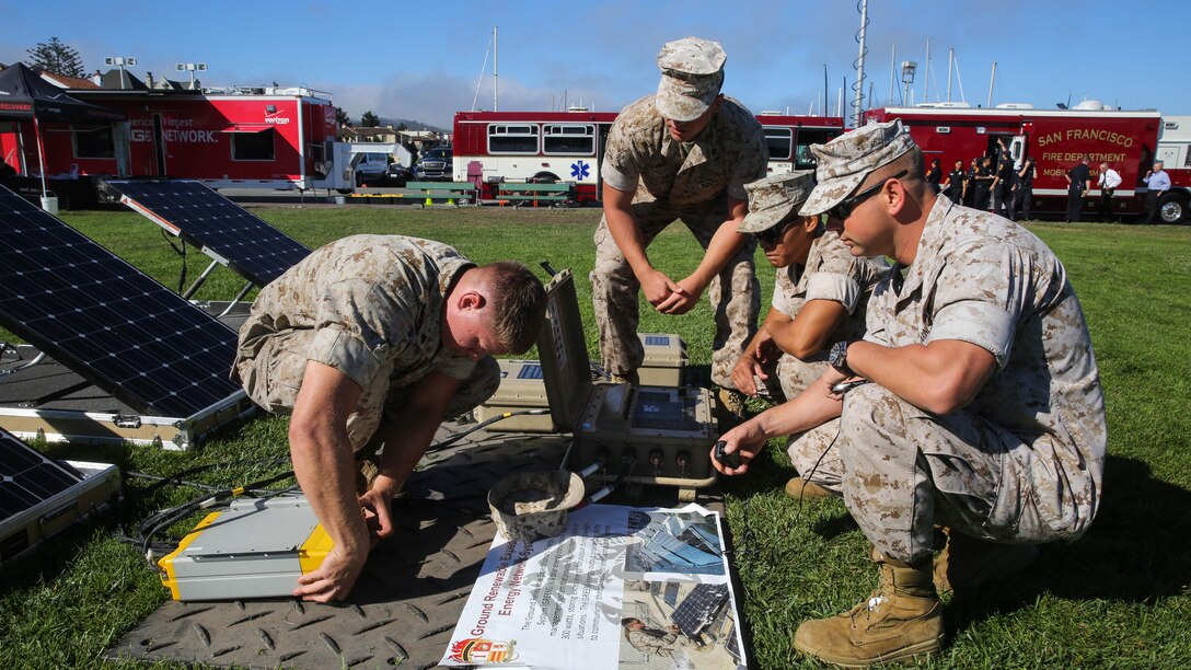 Marines with 1st Marine Logistics Group, 1st Marine Division, assemble solar panels during a humanitarian assistance and disaster relief static display at Marina Green Beach, Ssn Francisco, Oct. 9, 2015, as part of San Francisco Fleet Week 2015. SFFW 15’ is a week-long event that blends a unique training and education program, bringing together key civilian emergency responders and Naval crisis-response forces to exchange best practices focused on humanitarian assistance disaster relief with particular emphasis on defense support to civil authorities.